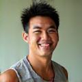 Portrait of Coach David Chen, a fitness expert with an energetic and encouraging demeanor.