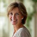 Portrait of Sarah Jenkins, a mental well-being counselor with a calm and empathetic expression.